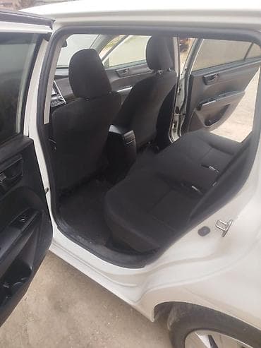 Транспорт: Toyota Corolla Fielder Hybrid – universal kuzovlu, ağ rəng. - Hibrid — 7