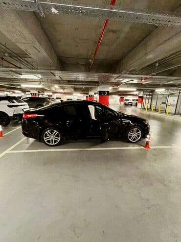 xrom diski: Kia Optima – qara rəng, sedan kuzov. Şəhərdaxili və magistral yollarda — 7