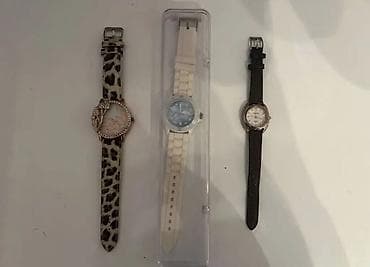 Qadın qol saatı - Korpus: qızılı tonlu dairəvi korpus, kənarı daş — 8