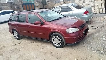uaz diski: Opel Astra Caravan (Universal) – bordo rəng, geniş və praktik ailə — 4