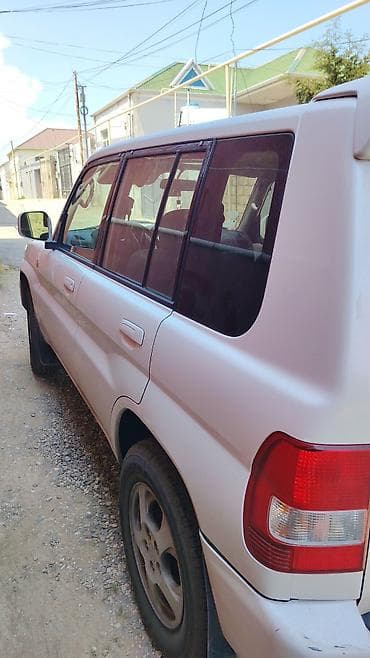 mitsubishi eclipse: Mitsubishi Pajero iO (GDI) – ağ rəngli, 5 qapılı yolsuzluq/siti — 3