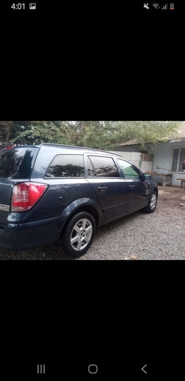 opel 1994: Opel Astra Caravan (universal kuzov) – tünd mavi rəng - Kuzov: 5 — 4