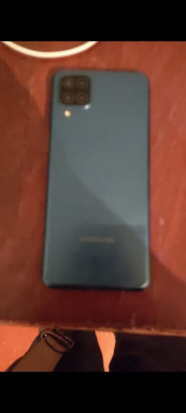 телефон fly fs504 cirrus 2: Samsung Galaxy A12, 32 ГБ, цвет - Голубой, Кнопочный — 2