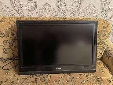 Sharp Aquos televizor. Qara rəngli, klassik dizayna malik düz ekran