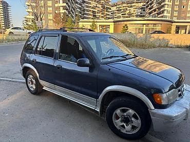 Kia Sportage: 2 l | 1999 il Ofrouder/SUV — 4