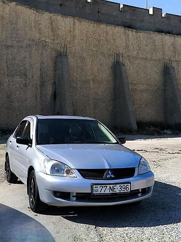 cəliloğlu avto: Mitsubishi Lancer sedan – gümüşü rəng, qara disklər. Nömrə: 77-NE-396 — 1