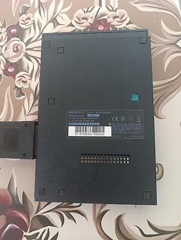 çoxlu oyun: Sony PlayStation 2 Slim konsolu - Model: SCPH-90004 (PAL) - Daxili — 2