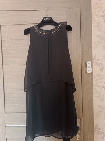 dest geyim: Qadın geyimləri – 2 paltar dəsti 1) Qara şifon paltar: - Rəng: qara - — 1