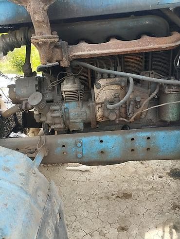 İstehsal avadanlığı: Mavi rəngli MTZ tipli təkərli traktor - Güc aqreqatı: dörd silindrli — 1