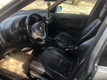 r18 bmw: BMW 3 Series E36 sedan – tünd boz rəngdə, klassik kuzov xəttləri ilə — 5