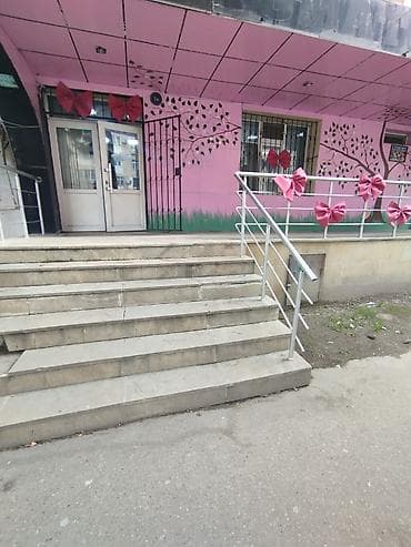 Daşınmaz əmlak: Əhmədli qəsəbəsi Qaçaq Nəbi küçəsi 1 ünvanında yerləşən 5 mərtəbəli — 4