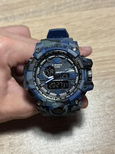 Casio G‑Shock saat – mavi kamuflyaj dizaynlı, analoq-rəqəmsal ekranlı — 1