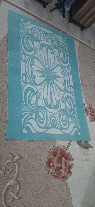 Yeni Xovlu Yataq örtüyü, Ünvandan götürmə