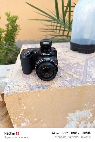 yemek bisiren aparat: Nikon brendinə məxsus qara rəngli fotoaparat, istifadəçilər üçün rahat — 2
