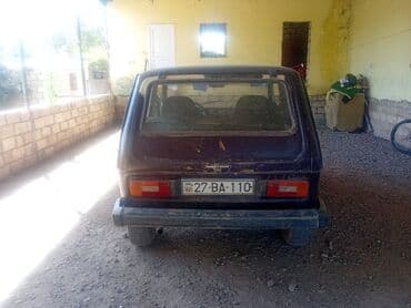 турбо.аз все об автомобилях в азербайджане: Lada Niva 4x4, bənövşəyi rəngli, 3 qapılı SUV. Xüsusiyyətlər: - Tam — 5