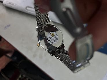 saatlar 2020: Qol saatı – iki rəngli (gümüşü və qızılı) metal qolbağlı, daşlı model — 1