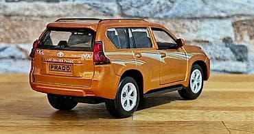 qedim pullar aliram: Metalik narıncı rəngdə Land Cruiser Prado mini model avtomobil — 4