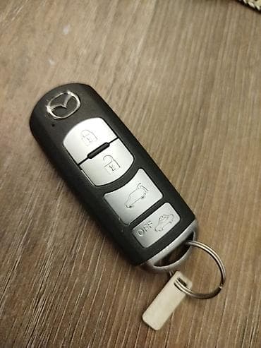 santafe 2012: Mazda smart açar (keyless) – 4 düyməli Xüsusiyyətlər: - Uzaqdan — 1