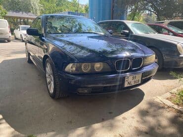 aston martin db7 5.9 at: BMW 5 series: 2.5 l | 2000 il Sedan — 4