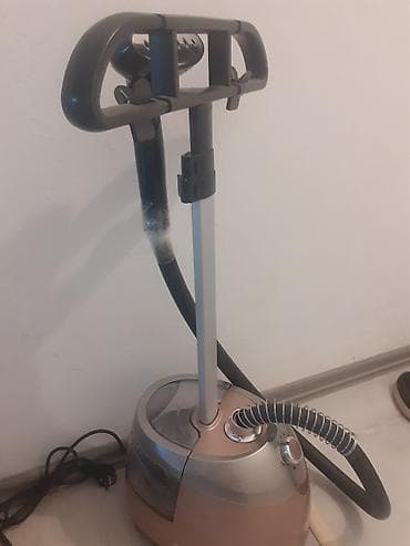 tefal utu qiymetleri: Paltaryuyan buxar ütüsü (vertikal geyim steameri) - Geyimləri asılı — 1