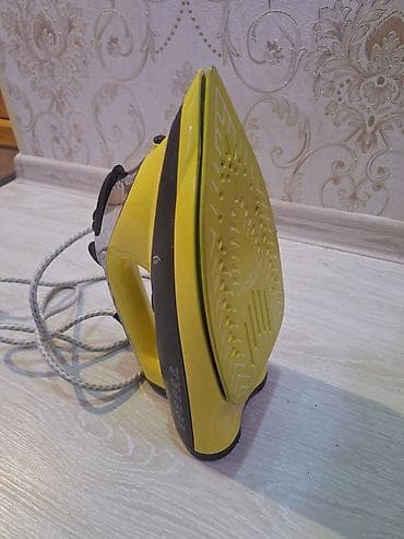 tefal utuler: Buxarlı ütü – sarı/qara dizayn Xüsusiyyətlər: - Titan örtüklü — 2