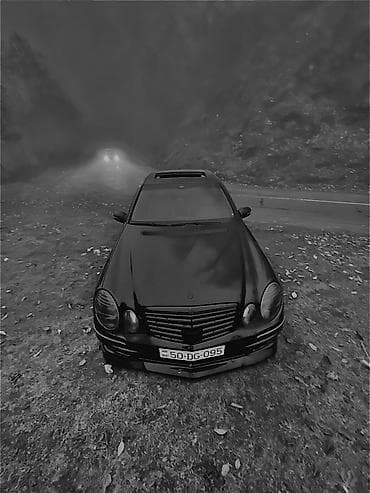 mercedes c190: Mercedes-Benz E‑Class (W211) sedan – qara rəng, AMG üslublu eksteryer — 1