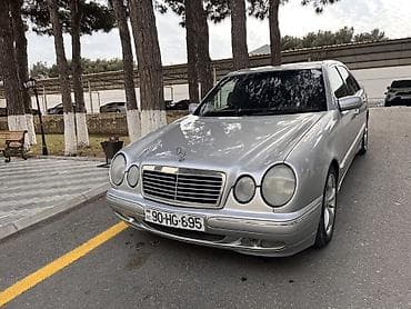 keys sat: Mercedes-Benz E-Class (W210) sedan, gümüşü rəng. - Kuzov: 4 qapılı — 2