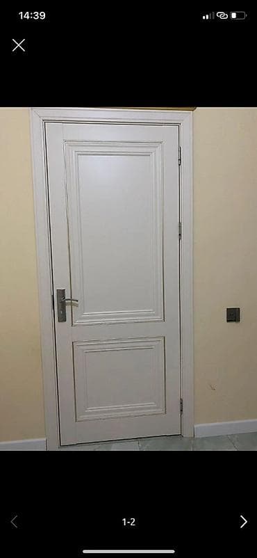 Dekorativ divar panelləri: Ağ rəngdə daxili otaq qapısı - Klassik dizayn: iki panelli (yuxarıda — 2