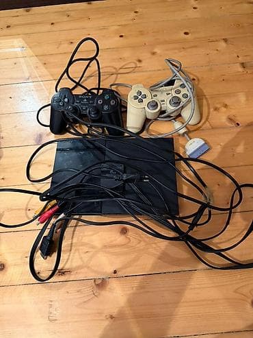 ps2 lazer: Playstation 2 (Ps2) İşlək vəziyyətdədir, problemsizdir. 2 ədəd pult — 1