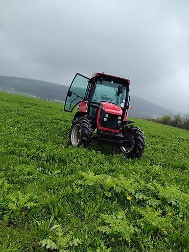 Qırmızı kabinəli təkərli traktor Xüsusiyyətlər: - Tam qapalı