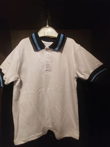 фольксваген поло замена: Ağ rəngli, qısaqol uşaq polo köynəyi. Qara və mavi zolaqlı yaxalıq və — 4