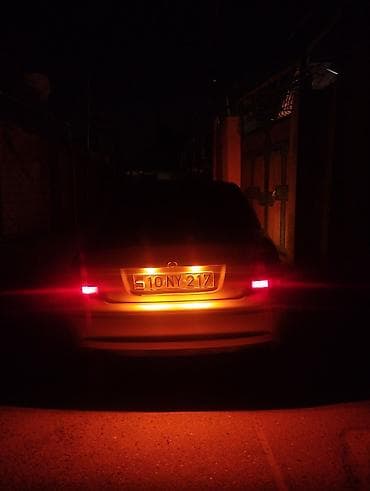 kia az: Gümüşü rəngdə sedan, idman üslublu eksteryer paketi ilə. - Kuzov: 4 — 8