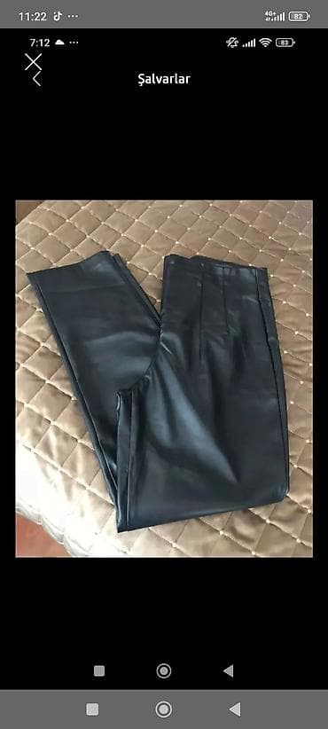 Alt paltarı: Qara rəngli qadın şalvarı – eko‑dəri görünümlü materialdan. Yüksək bel — 1