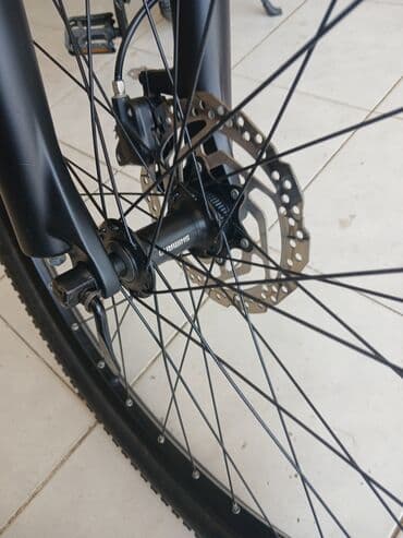 шоссейный велосипед trinx: Qara rəngli, Shimano Altus əyləc dəstəyi olan velosiped. Dəstək rahat — 10