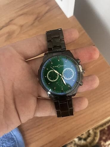 Kvars mexanizmlı kişi qol saatı - Brend yazısı: “NEWS WATCH” -