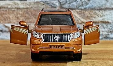 qedim pullar aliram: Metalik narıncı rəngdə Land Cruiser Prado mini model avtomobil — 1