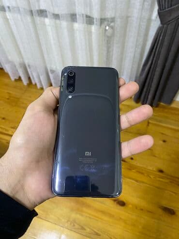 ТВ и видео: Xiaomi Mi 9, 64 ГБ, цвет - Черный, 
 Отпечаток пальца, Две SIM карты, Face ID — 3