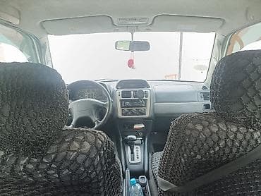 Mitsubishi: Mitsubishi Pajero iO (5 qapı) SUV - Kuzov: ağ/gümüş iki rəngli, yan — 4