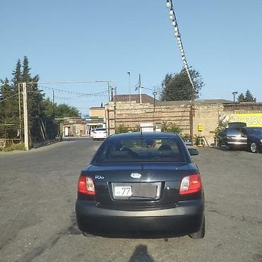 mini cooper 2009: Kia Rio: 1.4 l | 2008 il Sedan — 4