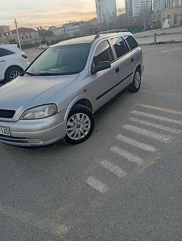 yuk baqajı: Opel Astra Caravan (universal) – gümüş rəng • Kuzov: universal (5 — 2