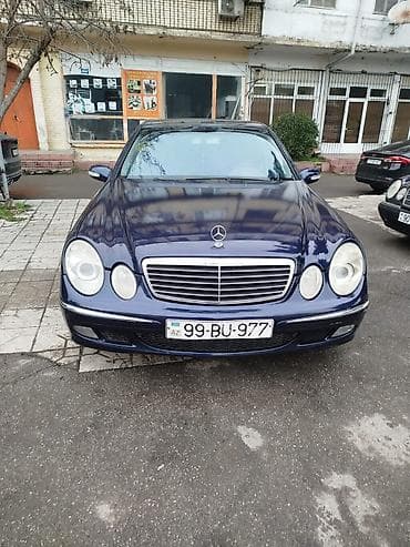 merse: Mercedes-Benz E‑Sinfi sedan (W211 kuzov), tünd mavi rəng. 2.7 cdi — 1
