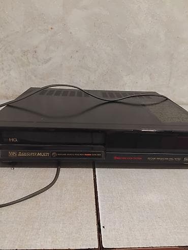 Elektronika: VHS videomaqnitofon – Multi System, 4 Head, HQ - Çoxsistemli dəstək — 1
