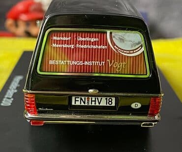 metbex tavan modelleri: Коллекционная модель Mercedes-Benz 200 W123 Hearse black 1982 Schuco — 20
