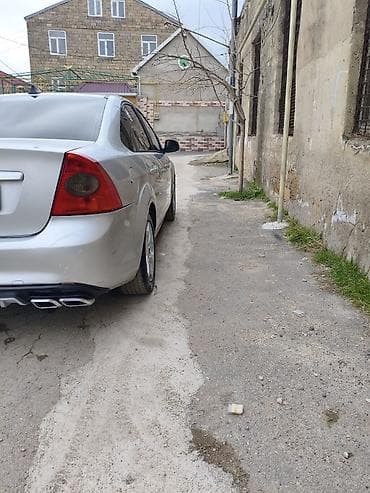 kia optima 2015: Ford Focus sedan – gümüşü rəng, benzinli. Avtomatik ötürücü, ön — 2