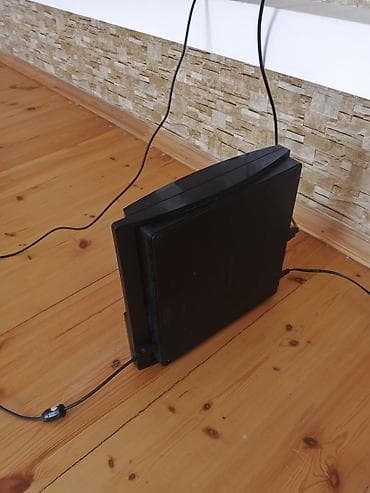 divarda televizor yeri: Sony PlayStation 3 (PS3) Slim oyun konsolu - Rəng: Qara - Korpus: PS3 — 3