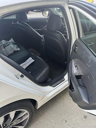 Avtomobil alışı: Kia Optima – ağ rəngdə, sedan kuzov. - Güclü və qənaətcil benzin — 7