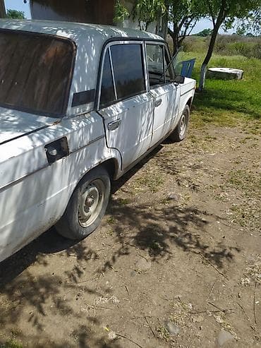 ucuz masnlar: VAZ 2106, ağ rəng, 4 qapılı sedan. Texniki və xarici xüsusiyyətlər: - — 3