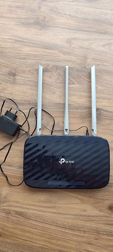 modemler: TP-Link Wi‑Fi router - Model: TP-Link (şəkildəki korpus və loqo ilə) — 1