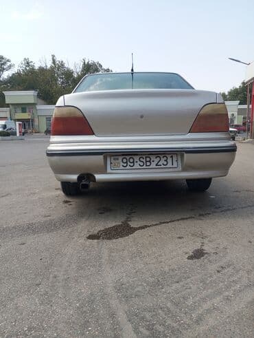 купить чехлы на авто: Model: Daewoo Nexia sedan Kuzov: 4 qapılı, gümüşü rəng — 2