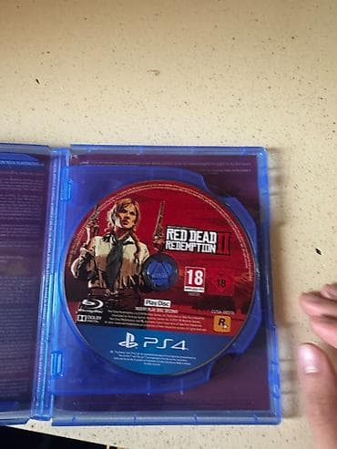 PS4 oyun diskləri – Uncharted: The Lost Legacy və Red Dead Redemption — 5
